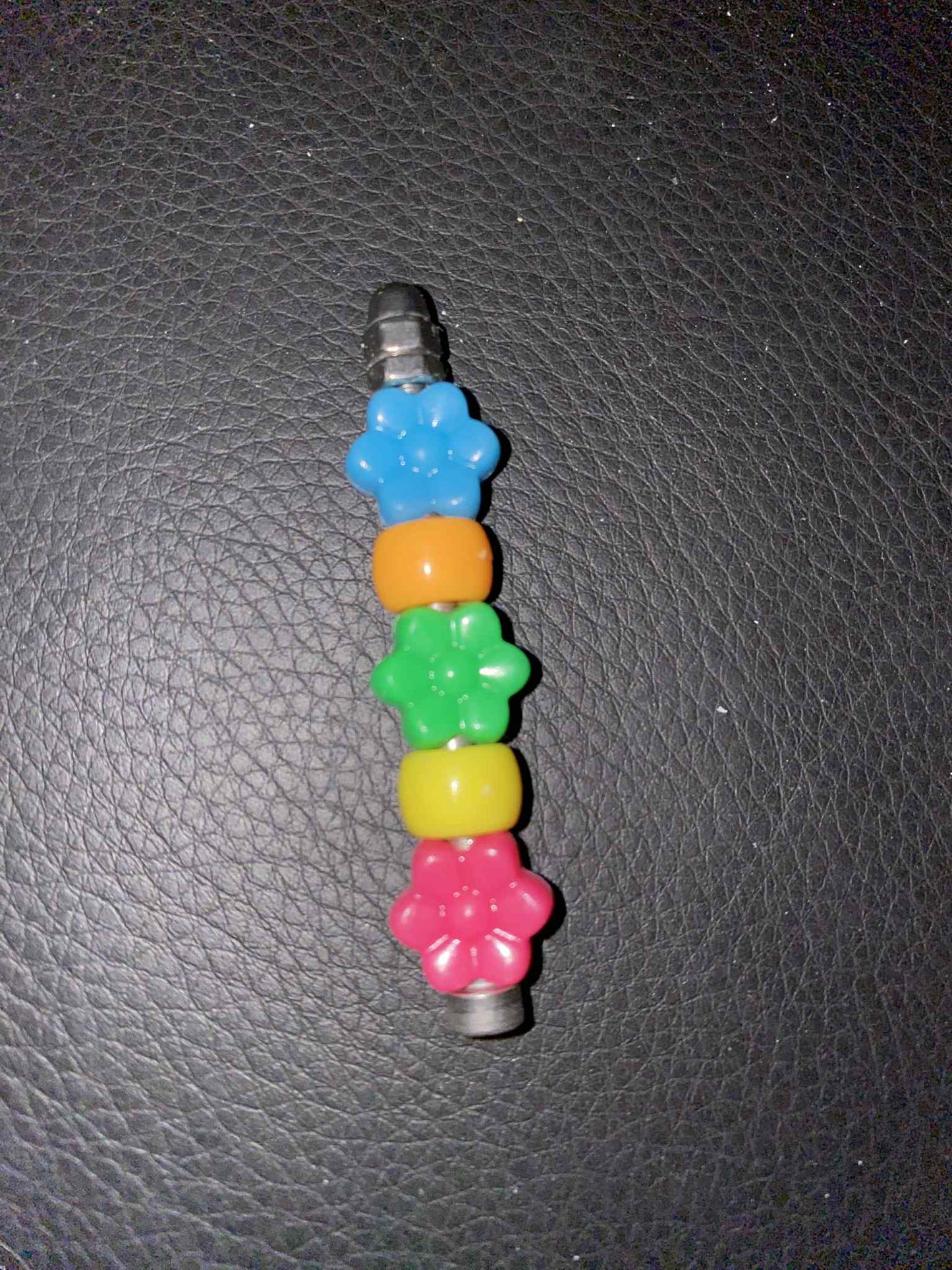 Pik & Grijp – Mini Parkietenplezier – 5cm RVS & Acryl Voetspeeltje
